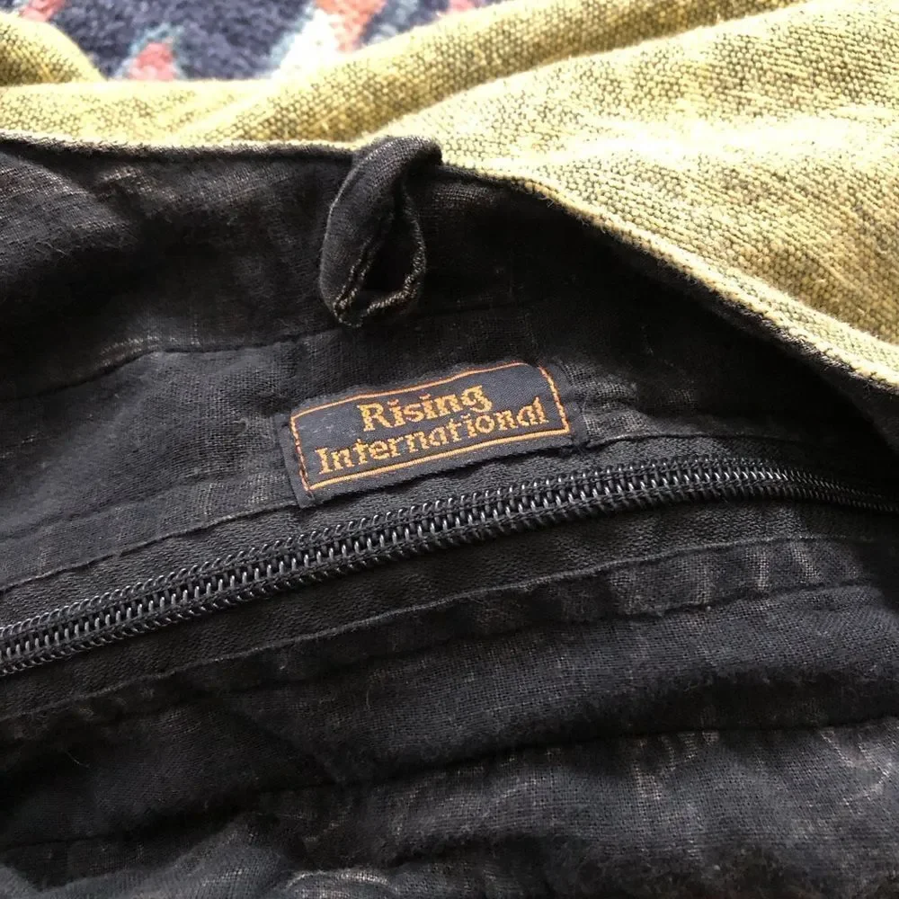 Rising International used zipper